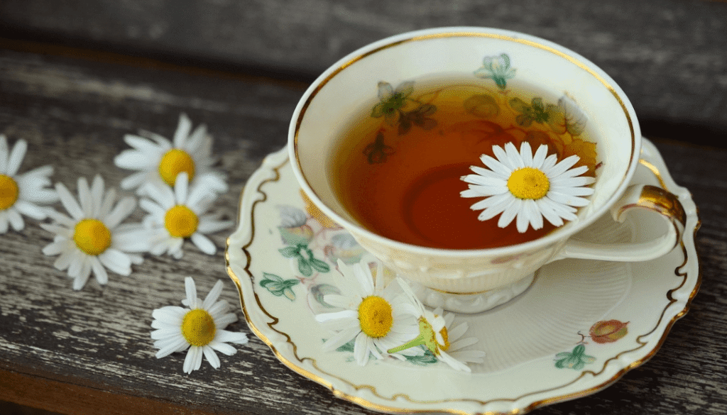 enjoying a hot cup of herbal green tea.